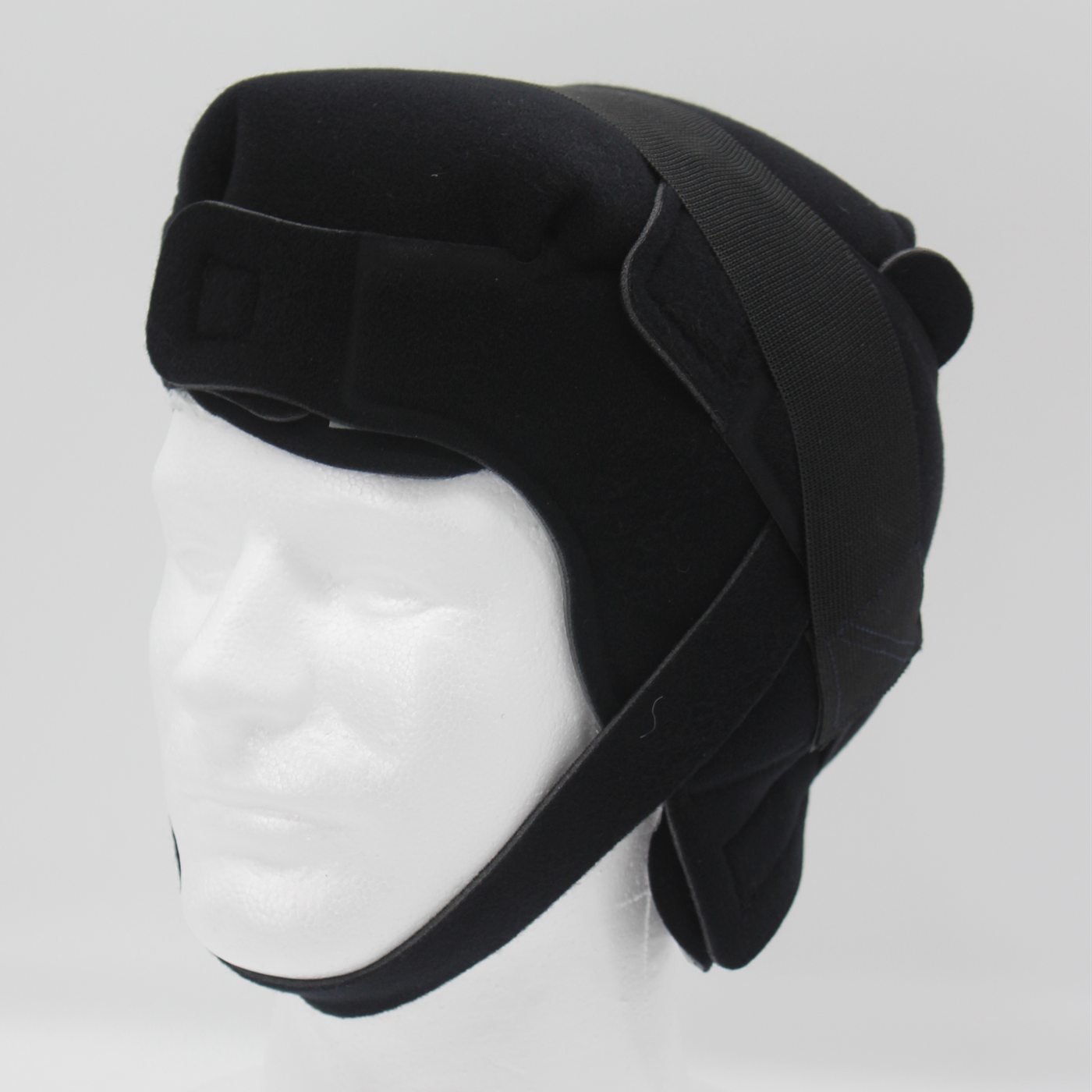 A Dalthera cold cap fitted on a display head, seen from the front and side