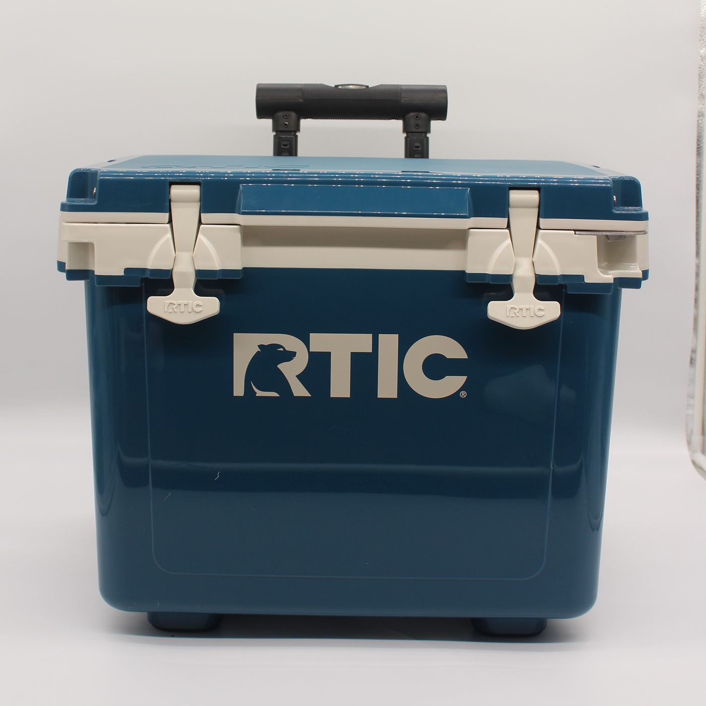 The rolling cooler with its handle raised